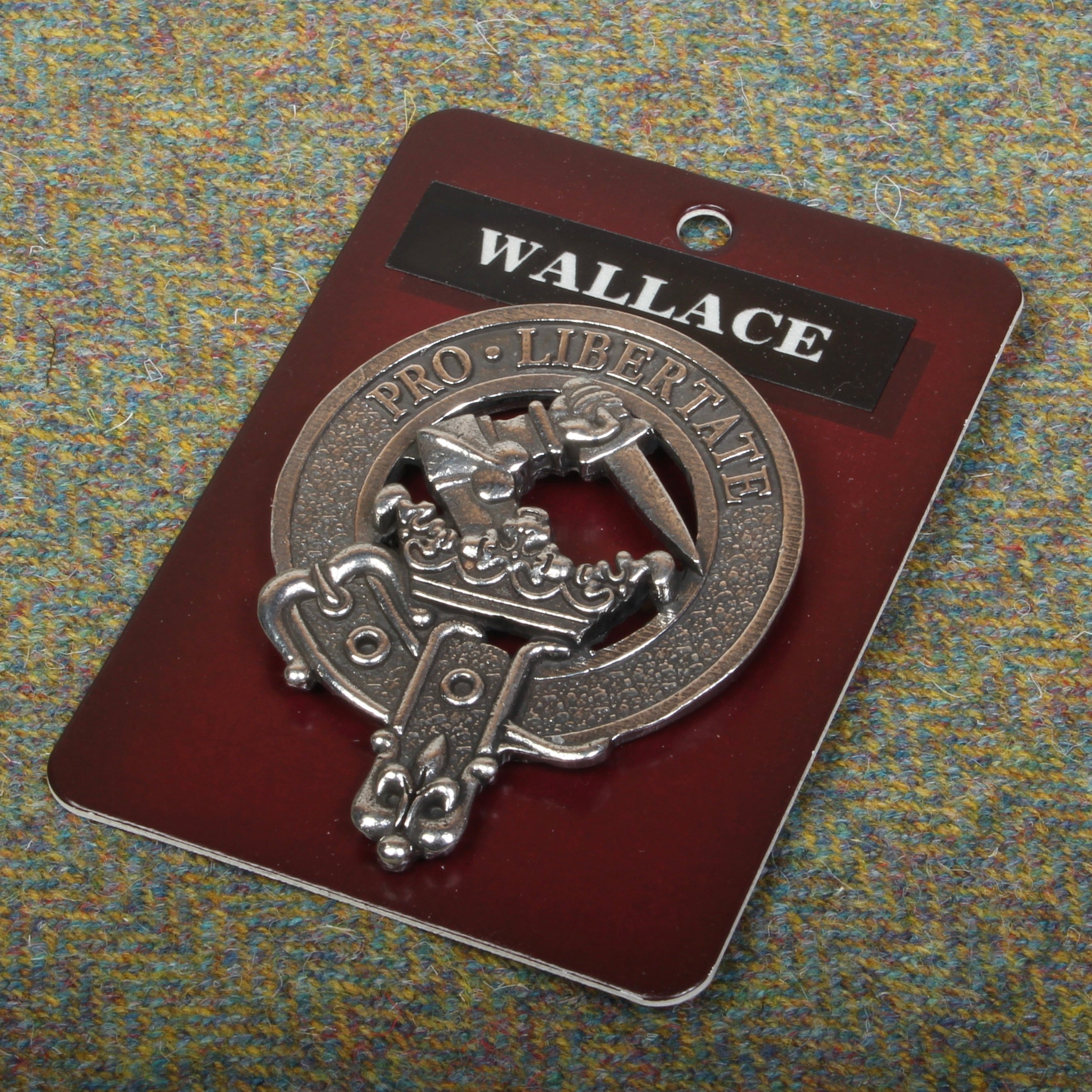 Detailed view of the Wallace Clan Crest Badge in Pewter, featuring a strong locking safety pin design for lasting durability.