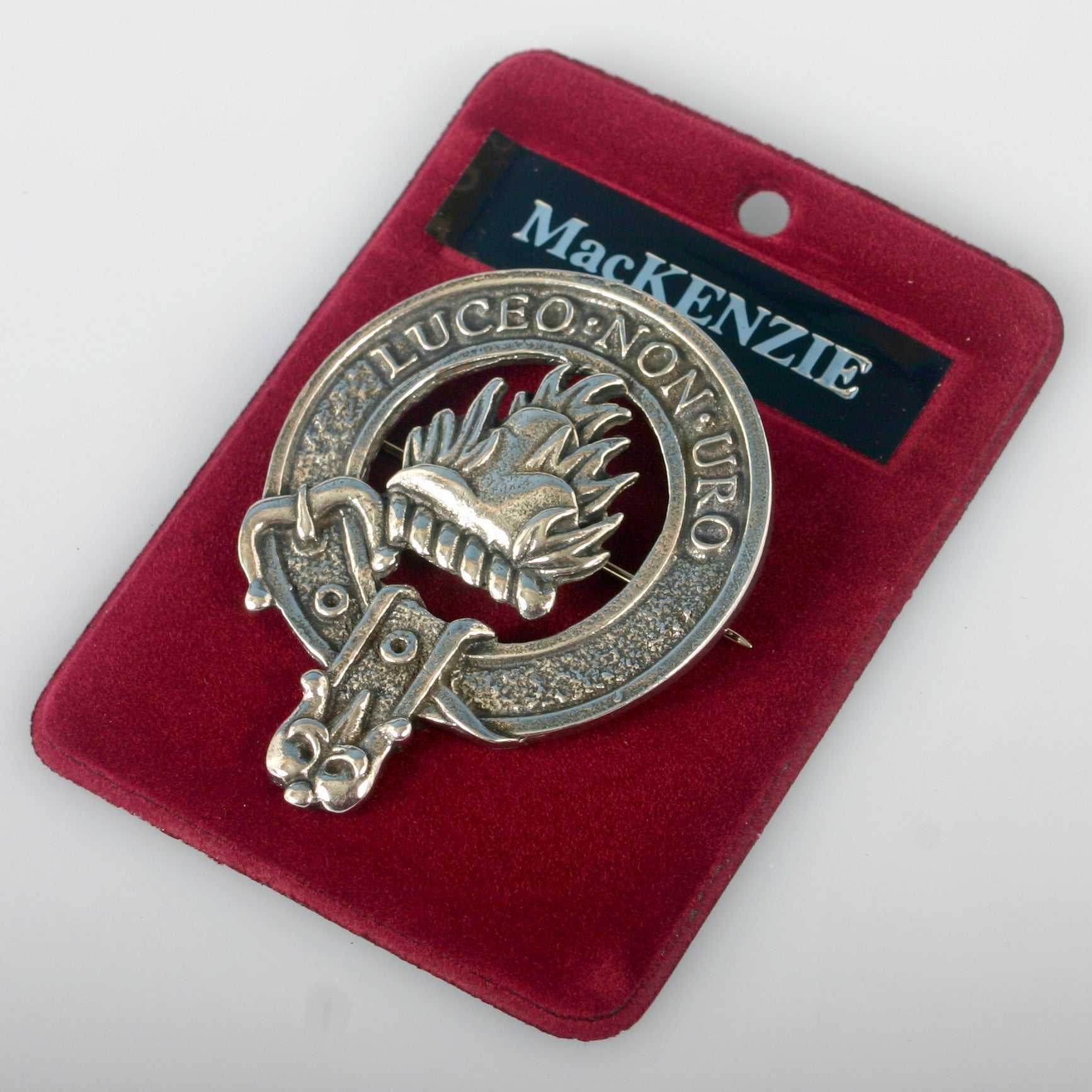 MacKenzie Clan Crest Badge in Pewter showcasing the traditional belted design, perfect for everyday wear or clan gatherings, measuring approximately 2" x 2.5".