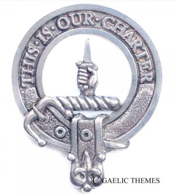 Charteris Clan Crest Badge in Pewter displayed on a textured background, showcasing the traditional belted design symbolizing clan heritage.