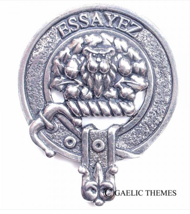Close-up of the Dundas Clan Crest Badge in Pewter featuring the intricate details of the crest and the strong safety pin design for secure fastening.