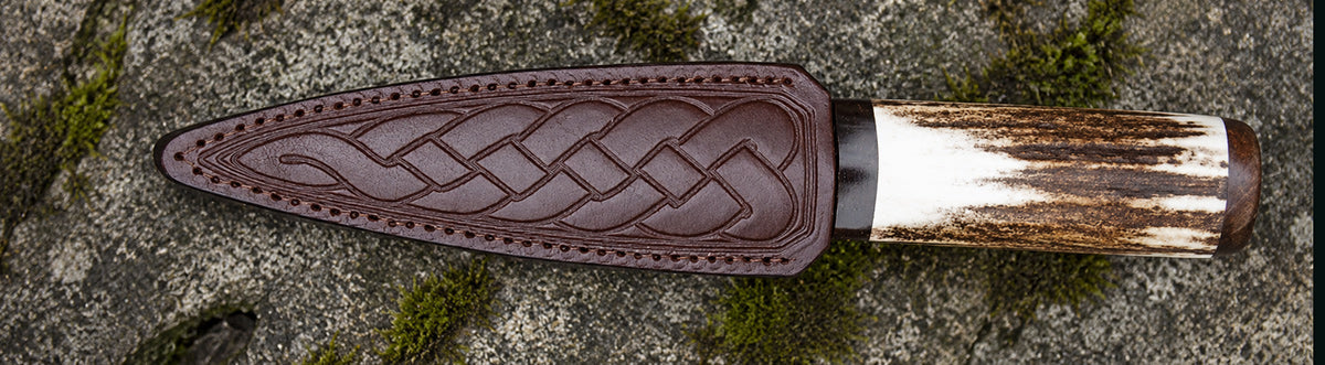 Clan Crest Sgain Dubh with coloured stone, showcasing intricate metalwork and customizable Scottish clan crest, made in Scotland.