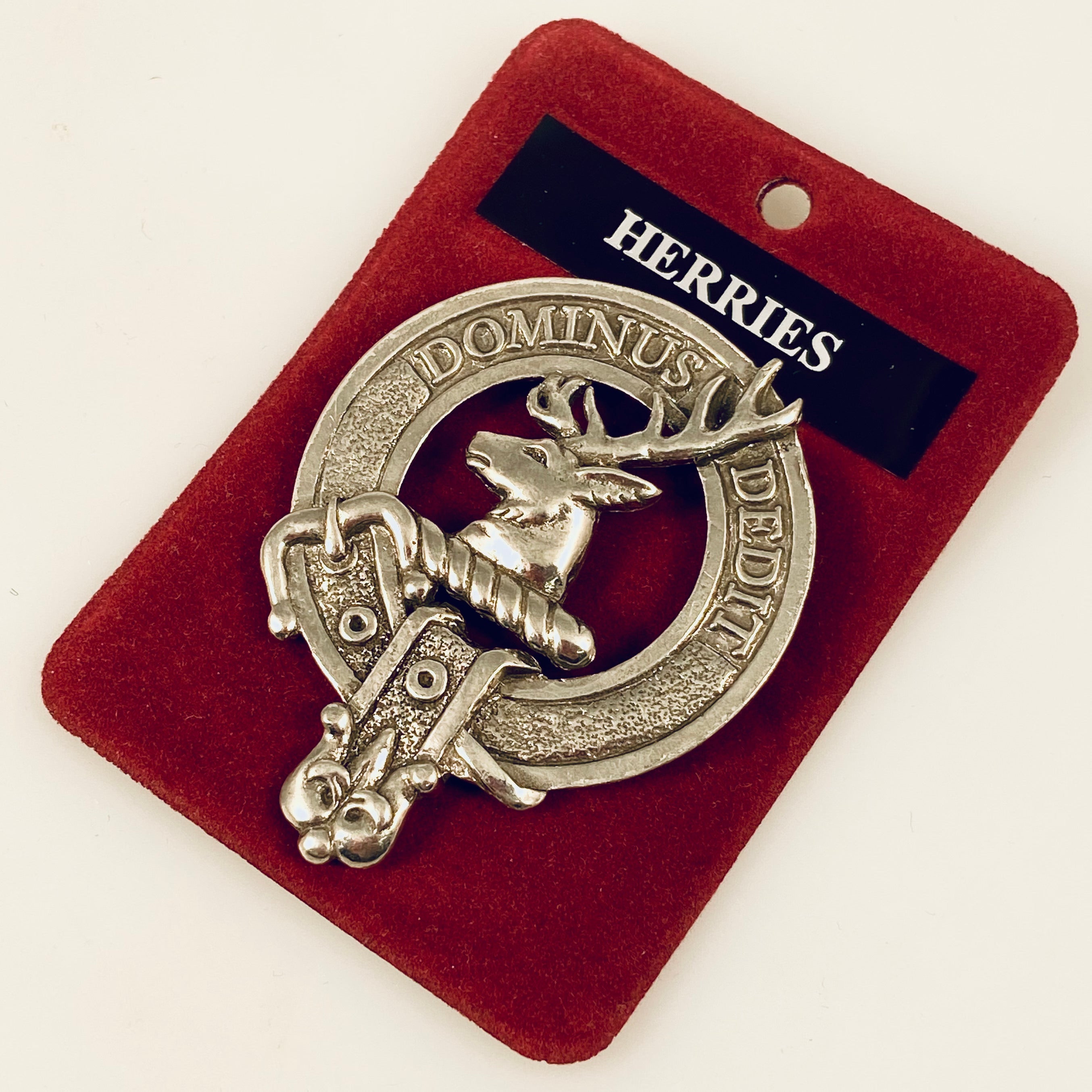 Herries Clan Crest Badge in Pewter worn as a brooch pin, showcasing the traditional belted design representing clan heritage. Perfect for everyday wear and gatherings.