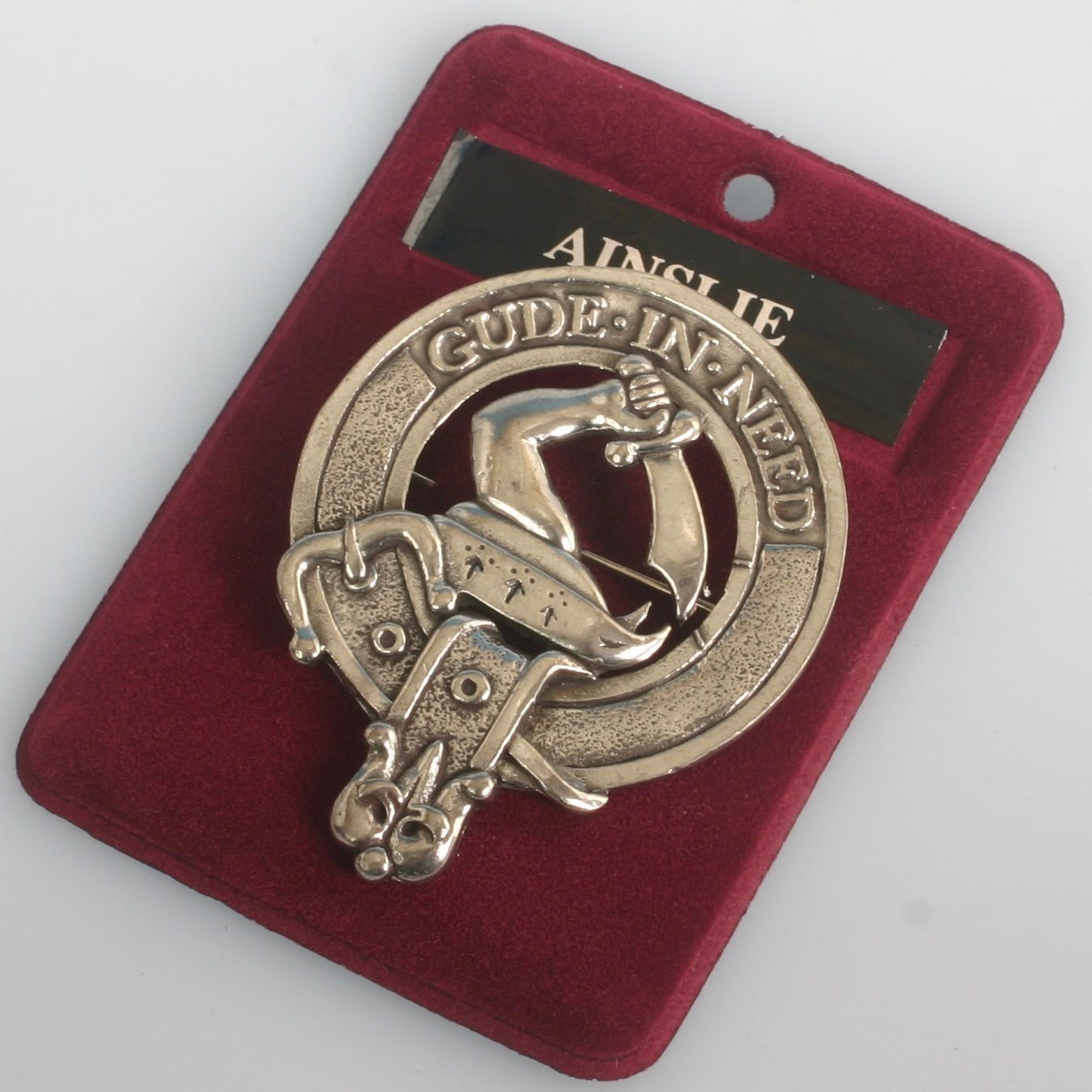 Ainslie Clan Crest Badge in Pewter showcasing the traditional belted design, ideal for everyday wear and clan gatherings.